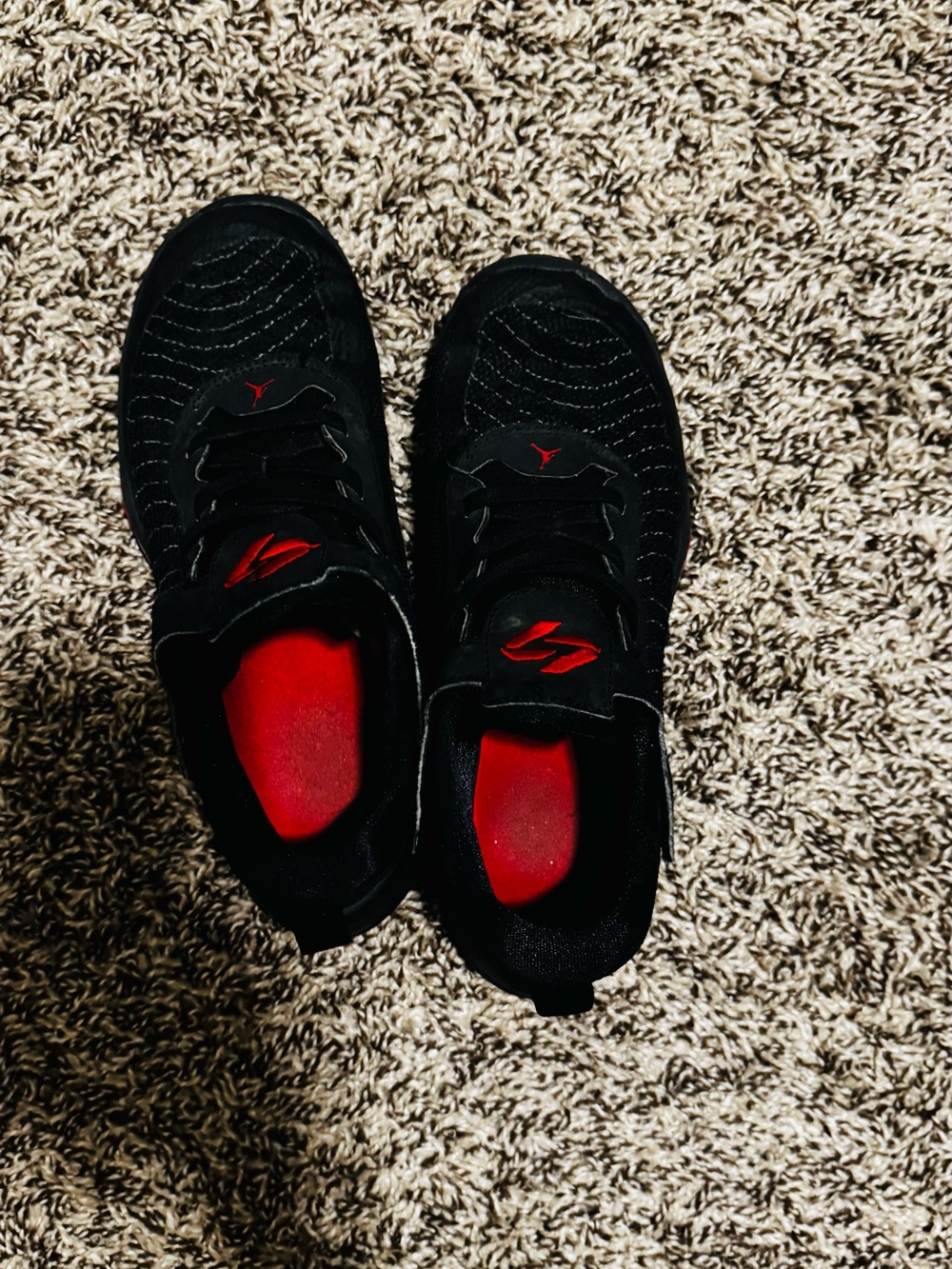 Nike Black Sneakers with Red Interior Accents